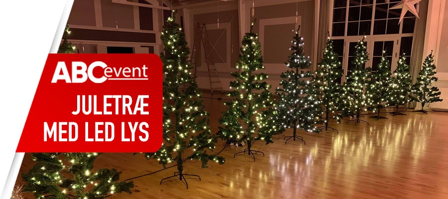 Eight shirts arranged on table in black, olive, grey, blue, white, red, mustard, and green.