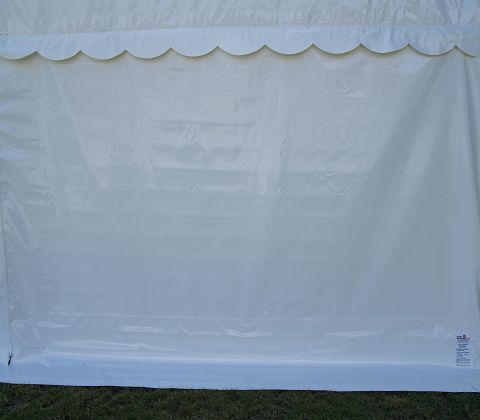 Eight shirts arranged on table in black, olive, grey, blue, white, red, mustard, and green.