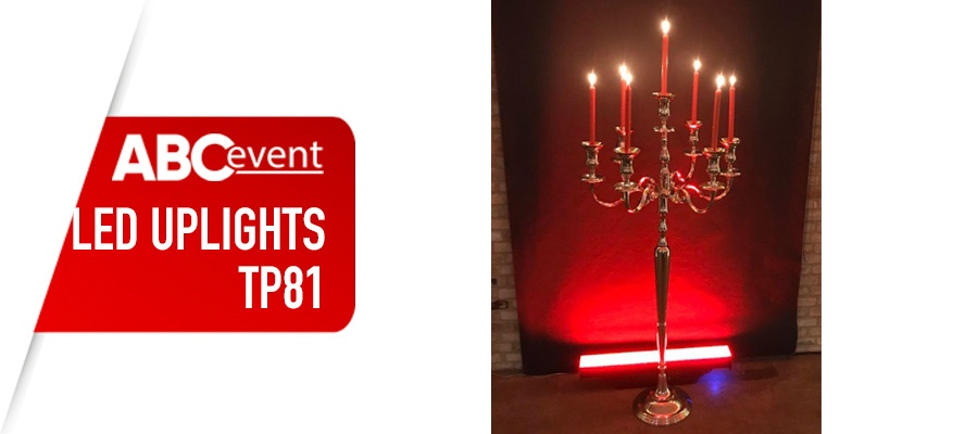 Eight shirts arranged on table in black, olive, grey, blue, white, red, mustard, and green.