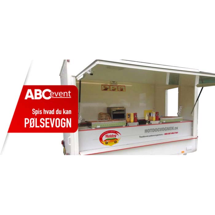 Eight shirts arranged on table in black, olive, grey, blue, white, red, mustard, and green.