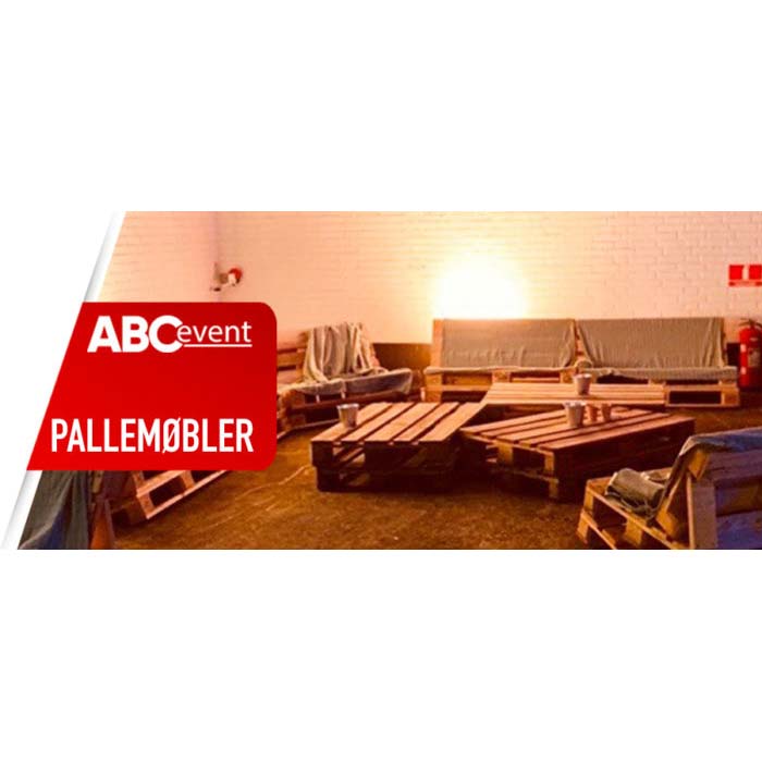 Eight shirts arranged on table in black, olive, grey, blue, white, red, mustard, and green.